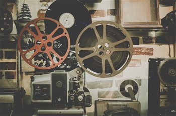 Cinematographer’s room, with film feels and other electronic equipment. Photo by Noom Peerapong via Unsplash